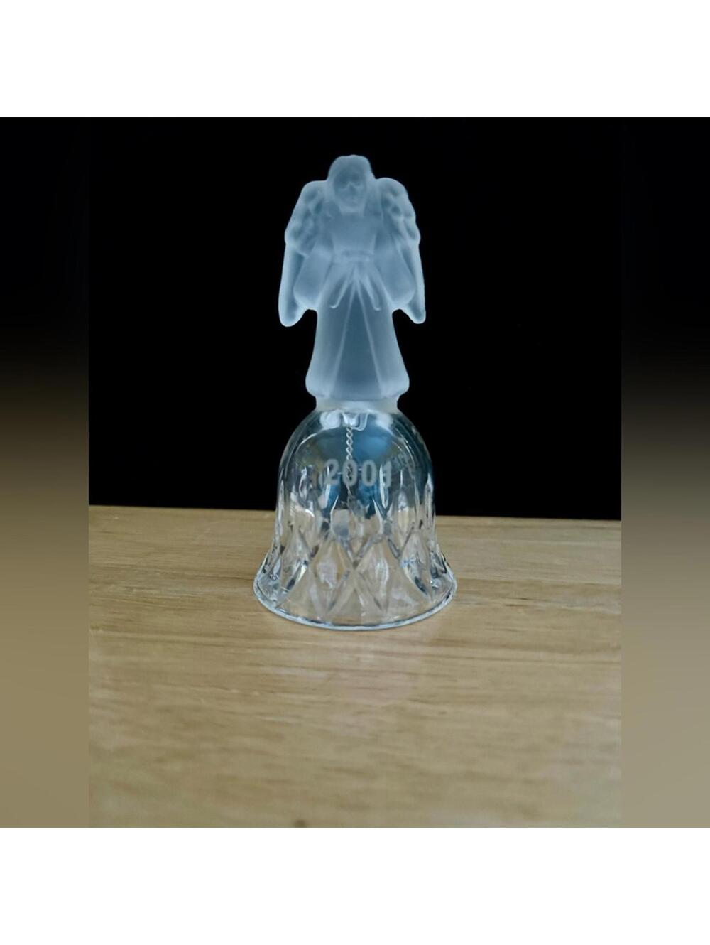 vintage frosted angel sits atop a crystal bell etched with the year 2001.
